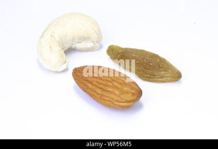Combination of cashew nuts, almonds nuts and raisins, healthy snack mixed nuts and dried fruits. Stock Photo