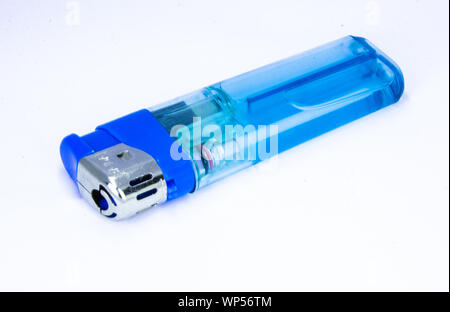 Red plastic gas lighter. Gas lighter isolated on white background. Closeup shot, top view Stock Photo