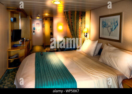 Independence of the seas interior inside  bed bedroom cabin balcony stateroom. Royal Caribbean cruise ship Independence of the seas Stock Photo