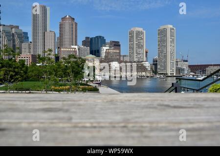 The downtown Boston skyline as seen from the Fan Pier Harbor Walk in the Seaport Innovation District in South Boston, Boston, Massachusetts, USA Stock Photo