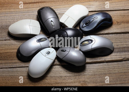 Computer Mouses on Wooden Background Stock Photo