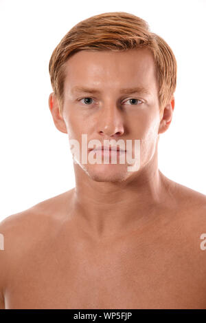 Handsome young man portrait isolated on white background. Muscular teenage guy portrait. Teenager boy face closeup Stock Photo