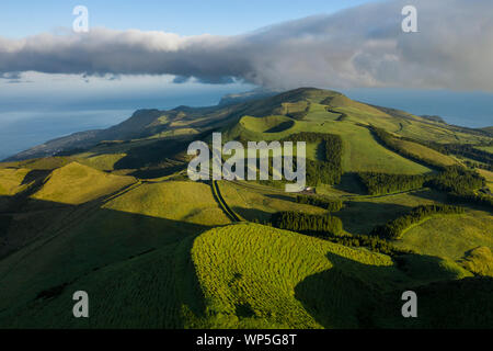 Aerial image showing the volcanic green crater mountain landscape of the San Jorge Island in the Azores, near pico de la Esperanza, Azores Stock Photo