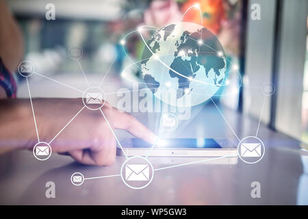 Finger pointing on smartphone with Global mutimeadia of business. business social network concept. Stock Photo