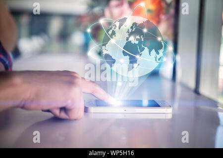Finger pointing on smartphone with Global mutimeadia of business. business social network concept. Stock Photo