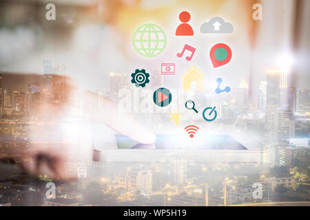 Close up image of smartphone with media icon and woman hands typing on screen. Stock Photo