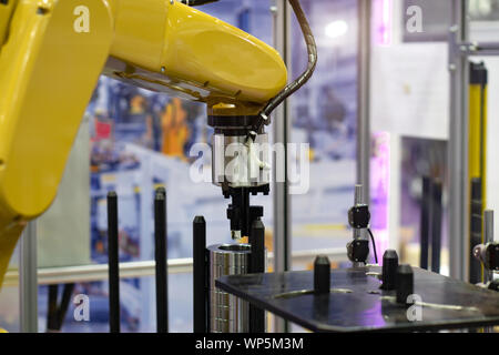 Robot hand machine in industrial that is working process. Stock Photo