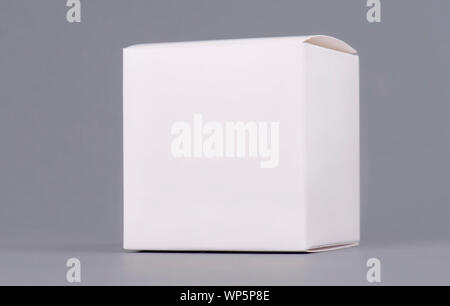 Square white carton product box mock up, side view, clipping path. Clean white cardboard blank mock up. Simple closed package template isolated. Store Stock Photo