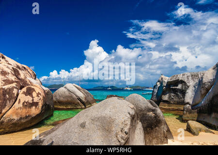 Looking our at sailboats over boulders at The Baths, Virgin Gorda, British Virgin Islands. Stock Photo