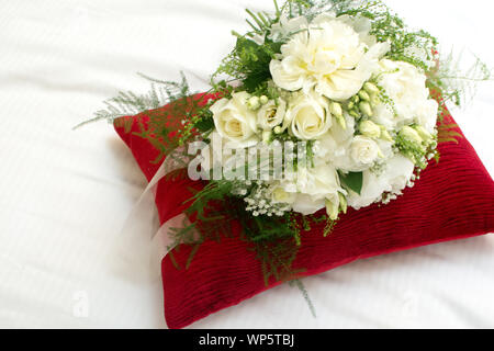 Wedding flowers Bridal bouquet of white flowers tied with a ribbon