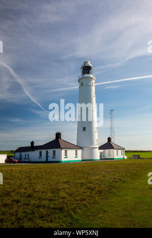 Nash Point lighthouse and its former keeper's cottages overlooking the Bristol Channel, Glamorgan, Wales, UK Stock Photo