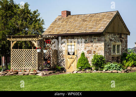 An Old Stone Cottage Doorway And Very Small Window At The Village