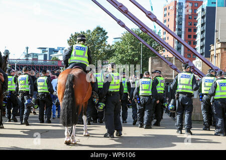 Glasgow, UK 07 September 2019. The Pro-Republican, Pro Irish group, the Calton Republicans marched through Glasgow's east end from Millroad Street to Clyde Street and stopped at the anti fascist statue celebrating the people of Glasgow who fought against Franco in the Spanish civil war. After the recent and significant street disturbances in Govan between sectarian groups there was a heavy police presence to prevent any disorder. Credit: Findlay/Alamy News Stock Photo