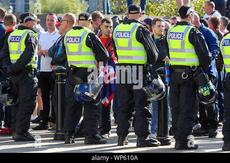 Glasgow, UK 07 September 2019. The Pro-Republican, Pro Irish group, the Calton Republicans marched through Glasgow's east end from Millroad Street to Clyde Street and stopped at the anti fascist statue celebrating the people of Glasgow who fought against Franco in the Spanish civil war. After the recent and significant street disturbances in Govan between sectarian groups there was a heavy police presence to prevent any disorder. Credit: Findlay/Alamy News Stock Photo