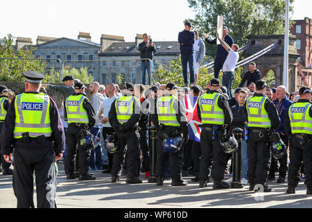 Glasgow, UK 07 September 2019. The Pro-Republican, Pro Irish group, the Calton Republicans marched through Glasgow's east end from Millroad Street to Clyde Street and stopped at the anti fascist statue celebrating the people of Glasgow who fought against Franco in the Spanish civil war. After the recent and significant street disturbances in Govan between sectarian groups there was a heavy police presence to prevent any disorder. Credit: Findlay/Alamy News Stock Photo