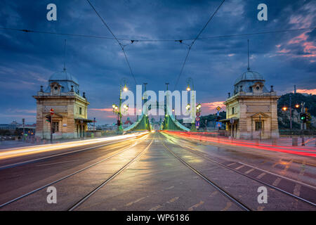 Liberty Bridge, Budapest. Cityscape image of Budapest with Liberty Bridge during twilight blue hour. Stock Photo