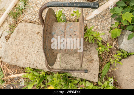 empty old cable reel rusty and dirty Stock Photo