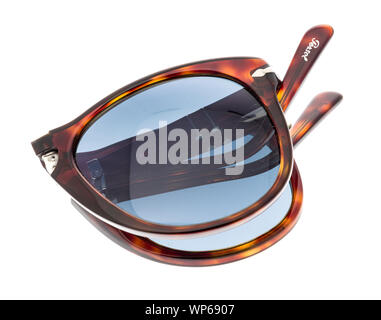 Wnneconne, WI - 4 September 2019:  A pair of Persol polarized sunglasses folded on an isolated background. Stock Photo