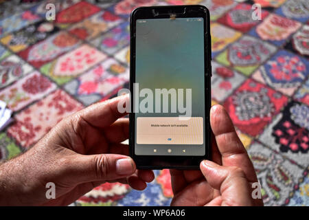 Srinagar, India. 07th Sep, 2019. Mobile network isn't available notification displayed on a smartphone during the shutdown in Srinagar.Communication blockade with mobile phones and Internet services continued to remain shutdown on 34th day here in Kashmir valley following the scrapping of Article 370 by the central government which grants special status to Jammu & Kashmir. However landline telephone services have been fully restored in the valley. Credit: SOPA Images Limited/Alamy Live News Stock Photo