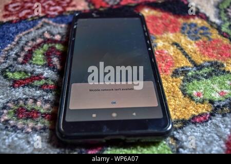 Srinagar, India. 07th Sep, 2019. Mobile network isn't available notification displayed on a smartphone during the shutdown in Srinagar.Communication blockade with mobile phones and Internet services continued to remain shutdown on 34th day here in Kashmir valley following the scrapping of Article 370 by the central government which grants special status to Jammu & Kashmir. However landline telephone services have been fully restored in the valley. Credit: SOPA Images Limited/Alamy Live News Stock Photo