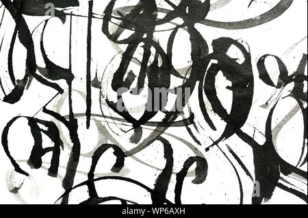 Black abstract brush strokes and splashes of paint on paper. Grunge art calligraphy background Stock Photo