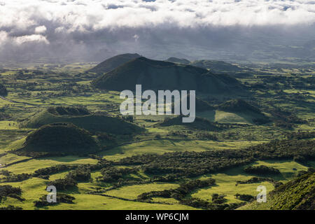 aerial like landscape after sunrise from Pico da Urze overlooking the typical gree countryside of Planalto da Achada plains of Ilha do Pico island wit Stock Photo
