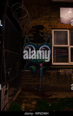 A cat like creature with big googly eyes drooling graffiti at Haven Street. Stock Photo