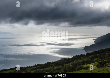 cloud shadows and sunlight reflections on the ocean water of the Pico-Sao Jorge channel, Azores, Portugal Stock Photo