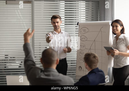 African american male manager raising hand, asking question at seminar. Stock Photo