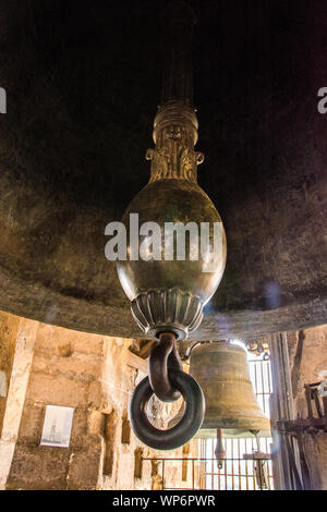 The clapper of a bell located in the bell tower of the Toledo Cathedral, Toledo, Spain. Stock Photo