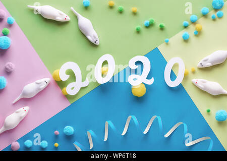 Happy New Year 2020, year of the mouse! Flat lay, top view of sweet white mice made from marshmallow with soft balls. Objects arranged on geometric pa Stock Photo