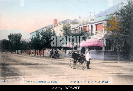 [ 1900s Japan - Western-Style Hotel in Kobe ] —   A jinrikisha (rickshaw) puller stands in front of the original Oriental Hotel at no. 80 in the foreign settlement in Kobe, Hyogo Prefecture.  20th century vintage postcard. Stock Photo