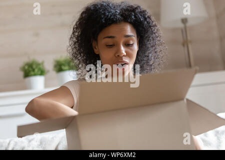 Frustrated african American woman disappointed with delivery service Stock Photo