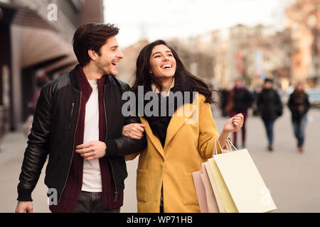 Happy millennial couple doing shopping on weekend Stock Photo