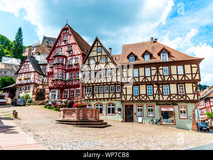Colorful half-timbered houses on the market place (Alter Marktplatz) in old german town Miltenberg am Main river. Odenwald, Bavaria, Germany