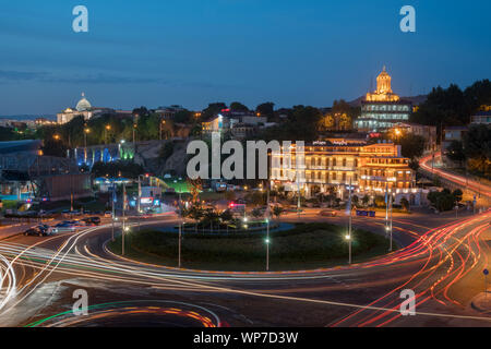 Tbilisi, Georgia - 30.08.2018: Night view over Europe square and Holy trinity Sameba church in the background. Travel. Stock Photo