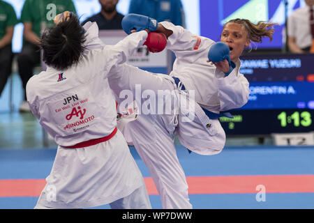 Tokyo, Japan. 7th Sep, 2019. ANNE LAURE FLORENTIN of France (blue) connects a sidekick to the face of Yuzuki Sawae of Japan (red) during the elimination round of Female Kumite's 68  kg category at Karate1 Premier League Tokyo 2019. Credit: Rodrigo Reyes Marin/ZUMA Wire/Alamy Live News Stock Photo
