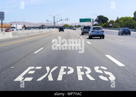 Express Lane marking on the freeway; San Francisco Bay Area, California; Express lanes help manage lane capacity by allowing single occupancy vehicles Stock Photo