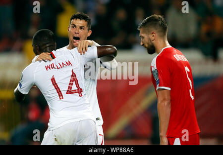 Belgrade. 7th Sep, 2019. Portugal's William Carvalho (L) celebrates with Cristiano Ronaldo (C) during the UEFA EURO 2020 Qualifying Round Group B match between Serbia and Portugal in Belgrade, Serbia on Sept. 7, 2019. Credit: Predrag Milosavljevic/Xinhua Stock Photo