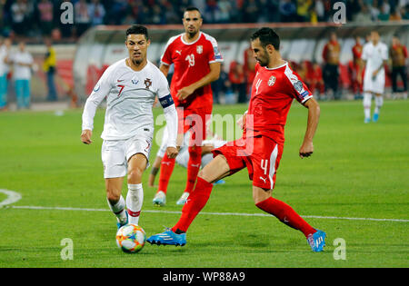 Belgrade. 7th Sep, 2019. Portugal's Cristiano Ronaldo (L) vies with Serbia's Luka Milivojevic (R) during the UEFA EURO 2020 Qualifying Round Group B match between Serbia and Portugal in Belgrade, Serbia on Sept. 7, 2019. Credit: Predrag Milosavljevic/Xinhua Stock Photo