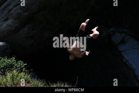 Oberstaufen, Germany. 31st Aug, 2019. A young man in the Buchenegger waterfalls jumps from a rock into a pump ten metres below. Credit: Karl-Josef Hildenbrand/dpa/Alamy Live News Stock Photo