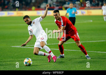 Belgrade. 7th Sep, 2019. Portugal's Bernardo Silva (L) vies with Serbia's Filip Kostic during the UEFA EURO 2020 Qualifying Round Group B match between Serbia and Portugal in Belgrade, Serbia on Sept. 7, 2019. Credit: Predrag Milosavljevic/Xinhua Stock Photo