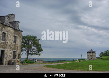 Porter, New York, USA: Visitors on the 23-acre grounds of the 18th-century Old Fort Niagara, on a cloudy day on Lake Ontario. Stock Photo