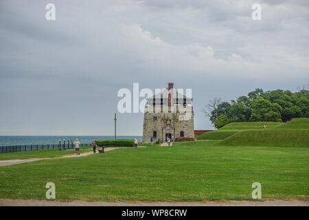 Porter, New York, USA: Visitors at the North Redoubt on the 23-acre grounds of Old Fort Niagara, on a cloudy day on Lake Ontario. Stock Photo