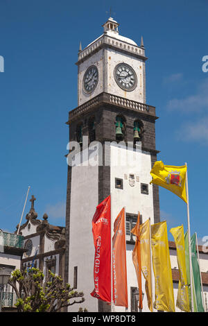 View of Sao Sebastiao church tower in the downtown of Ponta Delgada and flags with the names of the villages in the municipality. Azores, Portugal. Stock Photo