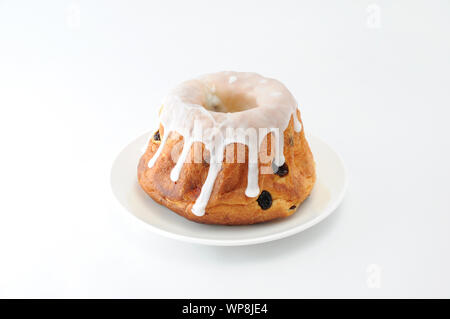 sweet cake Kouglof Gogelhopf on plate isolated on white background Stock Photo