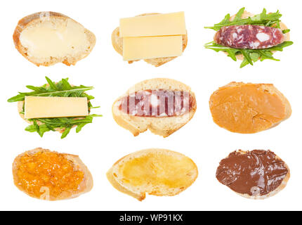 various open sandwiches on fresh bread isolated on white background Stock Photo