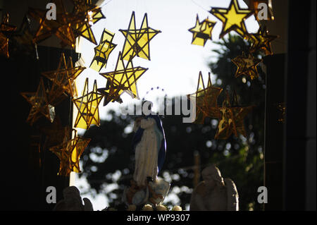 Ahuachapan, El Salvador. 8th Sep, 2019. A statue of the Virgin Mary is placed in the center of the Ahuachapan park. In the town of Ahuachapan, people come together to celebrate the eve of the birth of Virgin Mary. For 169 years, people light the streets of Ahuachapan with lanterns, now hundreds of locals and tourist take part in this tradition. Credit: Camilo Freedman/ZUMA Wire/Alamy Live News Stock Photo