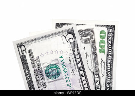 Stack of American dollar bills. Isolated. One, five, hundred us money close up. Stock Photo