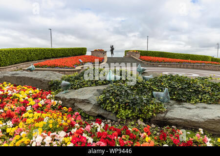 Bronze statue of famous English comedian Eric Morecambe at the seafront of Lancashire town of Morecambe is very popular with photographers. Stock Photo